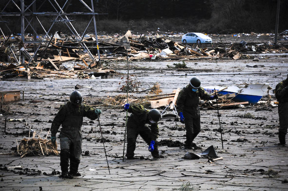 Survivors of Japan's Fukushima earthquake search through the mud, hoping they will find heirlooms, photos, family remains