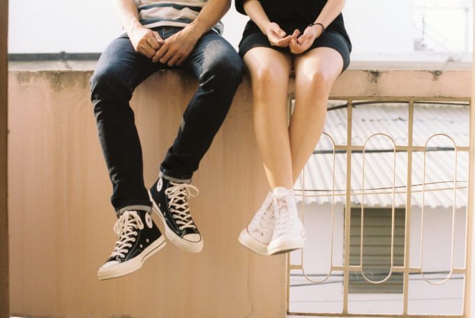 woman wearing white high top shoes