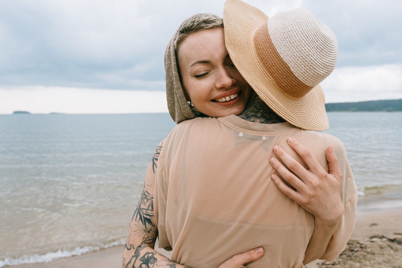 photo of women hugging each other