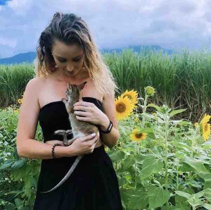 Shai Ager holding a joey