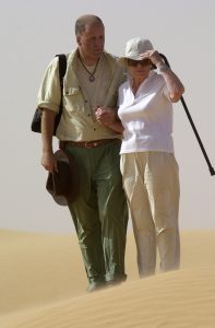 The BOAC Hermes crash landing inn the Sahara Desert. Widow Olwen Haslam makes a second visit to the grave of her husband Ted at the Lebgar Oasis. New Zealander Richard Gurney was a baby on board the crashed plane. In a brewing sand storm, Robert Watt guides Olwen Haslam to view the remains of the plane. Photo: © David Hill 2002