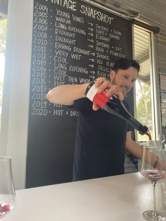 Rowley Milhinch pouring a red wine